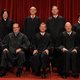 The nine members of the U.S. Supreme Court pose for photographs in the East Conference Room at the Supreme Court Building Oct. 8, 2010, in Washington, D.C. First row: Associate Justice Clarence Thomas, Associate Justice Antonin Scalia, Chief Justice John Roberts, Associate Justice Anthony Kennedy, Associate Justice Ruth Bader Ginsburg. Back row: Associate Justice Sonia Sotomayor, Associate Justice Stephen Breyer, Associate Justice Samuel Alito and Associate Justice Elena Kagan.
Chip Somodevilla/Getty Images